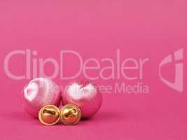 Pink vintage Christmas baubles on a pink background with space f