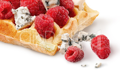 Closeup french waffles with raspberries and dorblu