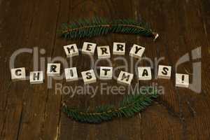 merry christmas spelled out in wooden blocks