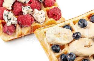 French waffles with berries, bananas and dorblu cheese isolated
