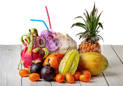 Tropical fruits on wooden table top view