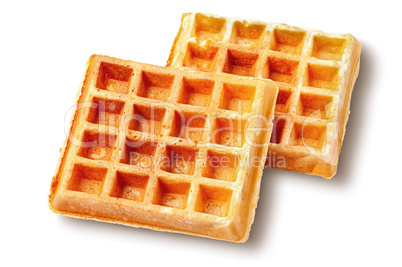 Two crispy fried french waffles isolated on white