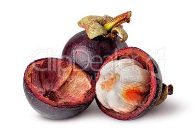 Whole and opened mangosteen with shells isolated on white