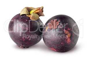Two ripe mangosteen isolated on a white