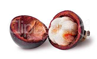 Opened mangosteen and shells near isolated on white