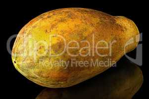 Papaya whole with reflection isolated on black