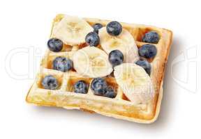 French waffles with blueberries and bananas top wiev