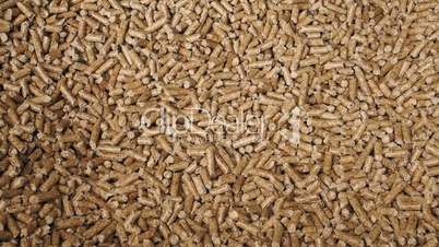 Man hands grab wood pellets and drop them, alternative energy, renewable energy