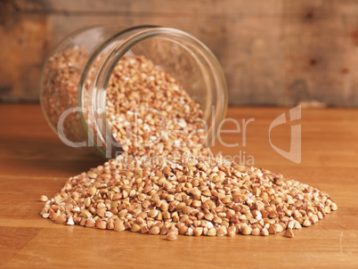 Organic buckwheat in a jar on a wooden table