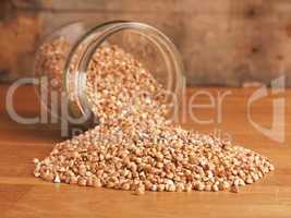 Organic buckwheat in a jar on a wooden table