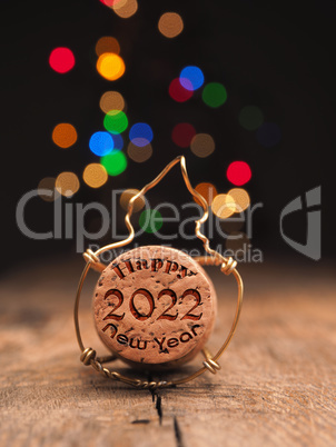 Cork of champagne bottle with inscription Happy New Year 2022