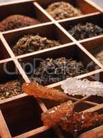 Rock candy with different kinds of tea in the wooden box