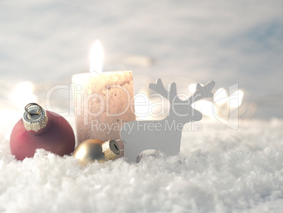 Christmas decoration in snow with candle, selective focus on Chr