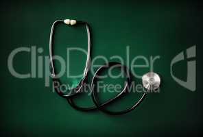 Stethoscope on green table
