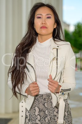 Pretty Asian woman with white jacket. X