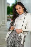 Pretty Asian woman with white jacket. IX