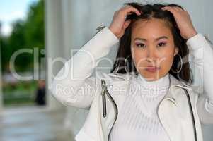 Pretty Asian woman with white jacket. VIII