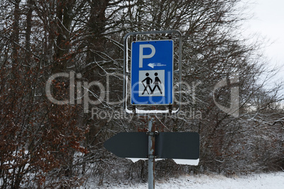 Signs indicating hiking trails in the winter forest
