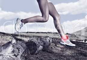 Theres risk of injury in every sport. A cropped view of a female runners legs with an injury.