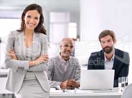 Cream always rises.... Shot of a young businesswoman standing in an office.