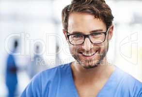 Here to help heal you. Portrait of a happy young man working as a surgeon in a hospital.