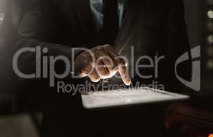 Prepared to do business. Cropped shot of an unrecognizable businessperson browsing on a digital tablet inside of the office during the day.