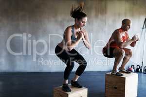 Reach your beast mode. Shot of a man and woman training together at the gym.