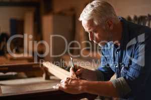 Patience-use it before you lose it. Cropped shot of a mature carpenter working hard.