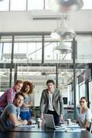 Portrait of the pros. Portrait of office workers in a meeting in a boardroom.