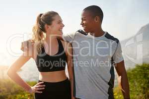 I can always count on you to keep me motivated. Shot of a fit young couple working out together outdoors.