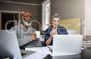 Taking control of their finances. Shot of a senior couple working on their finances at home.