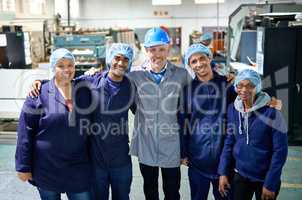 More than employees... Portrait of a people working inside a printing, packaging and distribution factory.