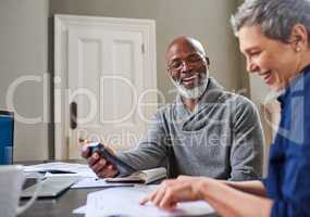 Financial planning has done them the world of good. Cropped shot of a senior couple working on their finances at home.