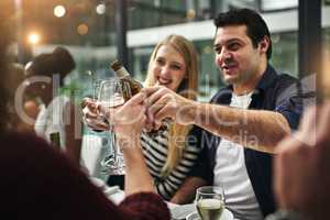 Good food, good friends, good times. Shot of friends having a dinner party at a restaurant.