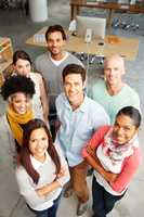 Leaders in their field. High angle view portrait of a group of multi-ethnic people in a work environment.