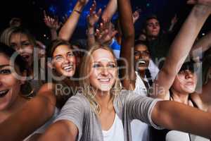 Attractive female fans enjoying a concert- This concert was created for the sole purpose of this photo shoot, featuring 300 models and 3 live bands. All people in this shoot are model released