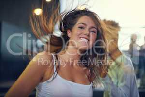 Young woman dancing to the music at a concert. This concert was created for the sole purpose of this photo shoot, featuring 300 models and 3 live bands. All people in this shoot are model released.