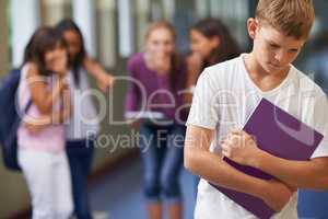 Being made to feel like an outcast. A young boy being bullied at school.