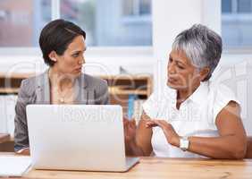 This is what I think we should do.... Shot of two colleagues working together at a laptop.