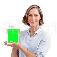 Advertise your business online. Studio portrait of a well-dressed mature woman holding a digital tablet with a chroma key screen.