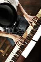 The makings of a creative genius. High-angle view of a young musician playing the piano.