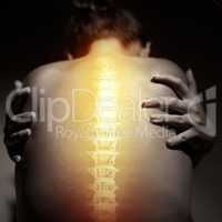 Back pain can be agonizing. Concept shot of a woman with severe back pain.