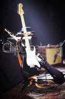 Behind the scenes at a gig. Electric guitars set up on a stage.