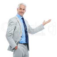The next big thing in business. Studio portrait of a handsome businessman gesturing to copyspace isolated on white.