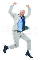 Business victory. Full length studio shot of a mature businessman jumping for joy isolated on white.