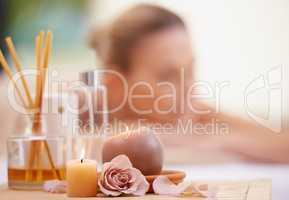 Basking in the afterglow of her massage. ropped shot of a mature woman relaxing on a massage table at a day spa.