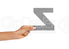 Showing you a letter. A young woman showing a backwards Z letter isolated on white.