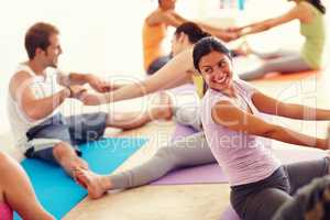 This is fun - Yoga routine. Two yoga partners performing a routine together to stretch out their legs.