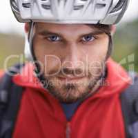 Can you handle the speed. Closeup portrait of a cyclist wearing a helmet.