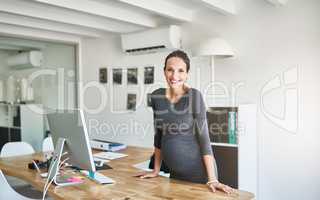 Maternity leave is just what I need. Cropped portrait of a pregnant businesswoman standing at her desk in the office.